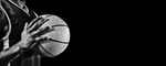 seorang pemain yang memegang bola basket, merepresentasikan sejarah bola basket di Indonesia yang berkembang pesat sejak pertama kali diperkenalkan pada awal abad ke-20